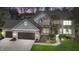 Charming two-story home featuring brick and siding, a two-car garage, and well-maintained landscaping at 9789 Logan Ln, Fishers, IN 46037