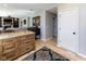Open-concept kitchen area with hardwood floors, granite countertops, and seamless flow to the living area at 9789 Logan Ln, Fishers, IN 46037