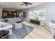 Spacious living room with large windows providing abundant natural light and a seamless flow to the outdoors at 9789 Logan Ln, Fishers, IN 46037