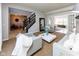 Bright living room featuring plush seating, neutral tones, and an open layout, ideal for modern living at 9789 Logan Ln, Fishers, IN 46037