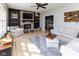 Inviting living room with fireplace and hardwood floors offers a cozy atmosphere for relaxation and gatherings at 9789 Logan Ln, Fishers, IN 46037