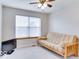 Bedroom with a futon couch, a window and a ceiling fan with lights at 9844 Plantana Blvd, Fishers, IN 46038