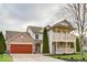 Charming two-story home features a double porch, brick accents, and a two-car garage at 9844 Plantana Blvd, Fishers, IN 46038