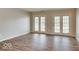 Bright living room with dual doors offering lots of natural light and luxury vinyl plank flooring at 9844 Plantana Blvd, Fishers, IN 46038