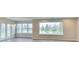 Bright living room features big windows with picturesque views of the outdoors and luxury vinyl plank flooring at 9844 Plantana Blvd, Fishers, IN 46038