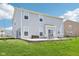 Spacious backyard boasts a patio area with outdoor seating and a well-maintained lawn for outdoor enjoyment at 9916 Gallop Ln, Fishers, IN 46040