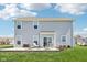 Well-manicured backyard features a patio with seating, a lush lawn, and a serene outdoor space for relaxation and entertainment at 9916 Gallop Ln, Fishers, IN 46040