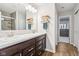 Dual sink bathroom with large mirror, modern fixtures, and spacious layout at 9916 Gallop Ln, Fishers, IN 46040