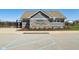 Well-maintained community pool house with stone and siding accents, and accessible parking at 9916 Gallop Ln, Fishers, IN 46040