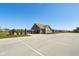 Wide shot of a community pool house, pool fencing, and manicured landscaping at 9916 Gallop Ln, Fishers, IN 46040