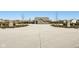 Community entrance view with decorative stone pillars and well-maintained landscaping at 9916 Gallop Ln, Fishers, IN 46040