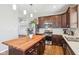 Contemporary kitchen featuring a center island with butcher block countertop at 9916 Gallop Ln, Fishers, IN 46040