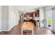 Open kitchen features stainless steel appliances, wood cabinets, and a center island at 9916 Gallop Ln, Fishers, IN 46040