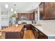 Modern kitchen featuring stainless steel appliances and a butcher block island at 9916 Gallop Ln, Fishers, IN 46040