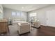 Bright living room showcasing modern furnishings and three large windows for natural light at 9916 Gallop Ln, Fishers, IN 46040