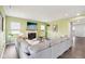 Comfortable living room features a fireplace, a large grey sectional sofa and contemporary decor at 9916 Gallop Ln, Fishers, IN 46040