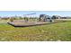 Community playground with swings, slides, and a wood chip ground cover at 9916 Gallop Ln, Fishers, IN 46040