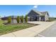 Community pool area with a fenced enclosure, restroom building, and green landscaping at 9916 Gallop Ln, Fishers, IN 46040