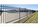 View of the community pool area, showcasing its secure fencing and concrete perimeter at 9916 Gallop Ln, Fishers, IN 46040