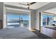 Bedroom featuring a ceiling fan, large windows with city views, and hardwood floors at 1 Virginia Ave # 707, Indianapolis, IN 46204