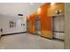 Elevator bay with three stainless steel elevators and bright orange and yellow accent paneling at 1 Virginia Ave # 707, Indianapolis, IN 46204