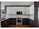 Well-equipped kitchen with stainless steel appliances, granite countertops, and subway tile backsplash at 1 Virginia Ave # 707, Indianapolis, IN 46204