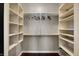 Spacious walk-in closet with custom shelving and hanging rods for optimal organization at 1 Virginia Ave # 707, Indianapolis, IN 46204