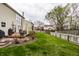 Well-maintained backyard with lush green lawn, wood deck, and privacy fence, perfect for outdoor enjoyment at 10220 Tournon Dr, Fishers, IN 46037