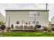 Well-maintained backyard with a wood deck, green lawn, and privacy fence, ideal for outdoor living and entertainment at 10220 Tournon Dr, Fishers, IN 46037