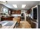 Spacious kitchen with dark wood cabinets, stainless steel appliances, and plenty of counter space at 10220 Tournon Dr, Fishers, IN 46037