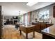 Open kitchen and dining area with wood floors, island, fireplace, and lots of natural light at 10220 Tournon Dr, Fishers, IN 46037