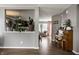 Serene living room features wood floors and seamlessly connected to additional living spaces at 10220 Tournon Dr, Fishers, IN 46037