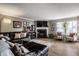 Relaxing living room with wood floors, a fireplace, and seamlessly connected to additional living spaces at 10220 Tournon Dr, Fishers, IN 46037