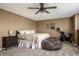 Comfortable main bedroom with a queen bed, bean bag, dresser, and neutral colors at 10220 Tournon Dr, Fishers, IN 46037