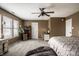 Large main bedroom with lots of natural light, neutral colors, and seating area with desk at 10220 Tournon Dr, Fishers, IN 46037