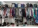 Spacious walk-in closet features ample hanging space and shelves for shoes and accessories, optimizing organization at 10220 Tournon Dr, Fishers, IN 46037