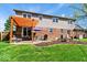 Large backyard with patio, dining set, pergola, grill and landscaping ideal for outdoor living and entertaining at 10533 Williamsburg Dr, Newburgh, IN 47630