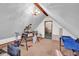 Spacious attic with exposed beam, chandelier, and doorway at 11015 S State Road 58, Columbus, IN 47201