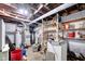 Unfinished basement with open ceiling and utilities at 11015 S State Road 58, Columbus, IN 47201
