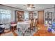 Traditional dining room featuring hardwood floors, decorative hutch, and ceiling fan at 11015 S State Road 58, Columbus, IN 47201