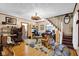 Spacious and well-lit living room with hardwood floors, staircase, and wood accents at 11015 S State Road 58, Columbus, IN 47201