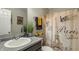 Charming bathroom showcasing vanity with sink, decorative Paris-themed shower curtain, and stylish accents at 11622 Brookwood Trace Dr, Indianapolis, IN 46229