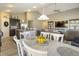 Inviting open-concept dining area with a view to living area and kitchen, perfect for Gathering gatherings at 11622 Brookwood Trace Dr, Indianapolis, IN 46229