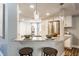 Bright kitchen with granite countertops, stainless steel appliances, and pendant lighting at 11674 Buttonwood Dr, Carmel, IN 46033