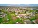 Aerial capturing the property with established lawns and trees, set in a community close to services and facilities at 118 Presidential Ct, Greenfield, IN 46140