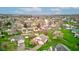 Residential area showcasing well-maintained homes, lush green lawns, and mature trees under a partly cloudy sky at 118 Presidential Ct, Greenfield, IN 46140