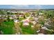 Full shot featuring dwellings surrounded by verdant lawns and mature trees, with proximity to shopping and transit at 118 Presidential Ct, Greenfield, IN 46140