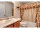 The bathroom features a vanity, toilet, and shower/tub with a beige curtain at 118 Presidential Ct, Greenfield, IN 46140