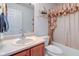 The bathroom features a vanity, toilet, and shower/tub with a beige curtain at 118 Presidential Ct, Greenfield, IN 46140