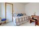 Well-lit bedroom featuring a daybed with decorative pillows and classic furnishings at 118 Presidential Ct, Greenfield, IN 46140